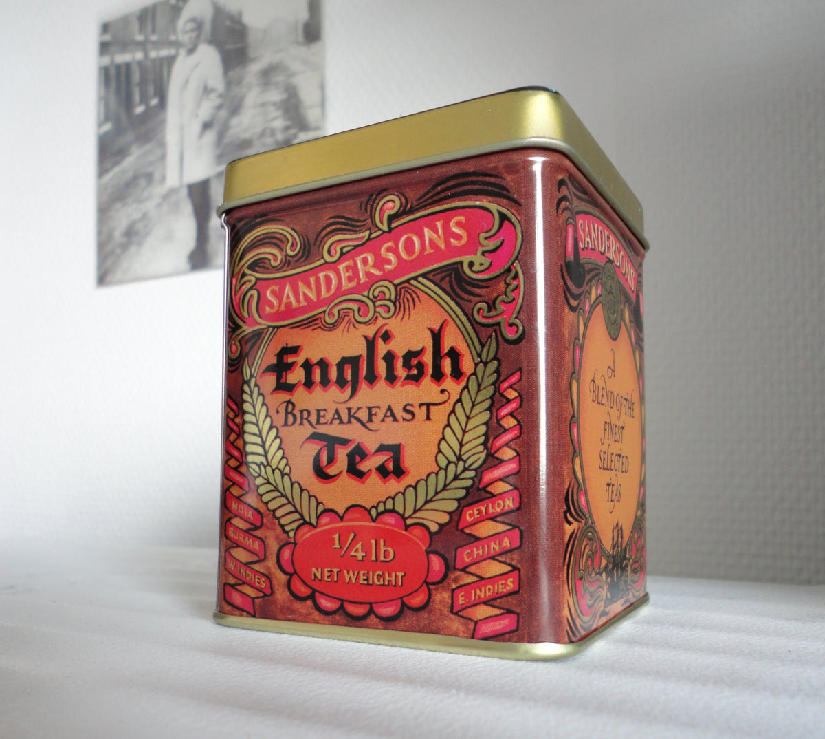 An opaque metal tea tin, the type of airtight container recommended for storing rose tea